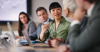 Woman in green discussing condo association risk management